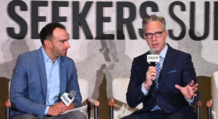 NEW YORK, NEW YORK - AUGUST 14: (L-R) Ramin Setoodeh, Co-Editor-in-Chief, Variety and Truth Seekers Award recipient Jake Tapper speak onstage during the Variety + Rolling Stone Truth Seekers Summit, presented by Paramount+ on August 14, in New York, New York.   (Photo by Bryan Bedder/Variety via Getty Images)