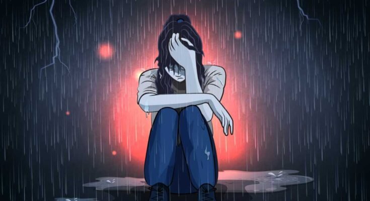 Una adolescente deprimida ve sola bajo la lluvia.
